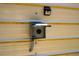 Outdoor power outlet on the side of a metal shed, featuring a weather-resistant cover and integrated solar light at 117 Castlerock Dr, Durham, NC 27713