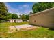 Exterior shot of metal storage shed with concrete pad, offering practical solutions for outdoor storage needs at 117 Castlerock Dr, Durham, NC 27713