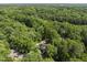 Aerial view of wooded property with mature trees surrounding the home at 117 Queensferry Rd, Cary, NC 27511