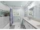 Bright bathroom with shower-tub combo, single vanity, and light blue walls at 117 Queensferry Rd, Cary, NC 27511