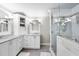 Spa-like bathroom featuring double vanities, a glass-enclosed shower, and stylish fixtures at 117 Queensferry Rd, Cary, NC 27511