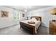 Cozy bedroom with shiplap accent wall, plush carpet, and plenty of natural light at 117 Queensferry Rd, Cary, NC 27511