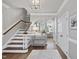 Inviting foyer with hardwood floors, staircase, and stylish décor, creating a warm welcome at 117 Queensferry Rd, Cary, NC 27511