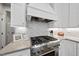 Modern kitchen with stainless steel stove, subway tile backsplash, and ample countertop space at 117 Queensferry Rd, Cary, NC 27511