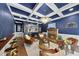 Elegant living room boasts a coffered ceiling, full bar, brick fireplace, and stylish seating area at 117 Queensferry Rd, Cary, NC 27511