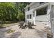 Backyard patio featuring a cozy seating area and a well-manicured lawn at 117 Queensferry Rd, Cary, NC 27511