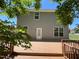 A spacious wooden deck overlooking a backyard, perfect for outdoor entertaining and relaxation at 1208 Olympic Dr, Mebane, NC 27302