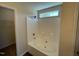 Clean bathroom features a tub-shower combo with white tile, perfect for a refreshing experience at 1208 Olympic Dr, Mebane, NC 27302