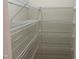 Walk-in closet featuring an organized shelving system, providing storage solutions for wardrobe and accessories at 1208 Olympic Dr, Mebane, NC 27302