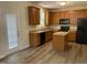 Well-equipped kitchen features ample cabinetry and modern appliances and island, perfect for culinary enthusiasts at 1208 Olympic Dr, Mebane, NC 27302