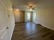 Spacious living room with luxury vinyl plank flooring, offering a bright and airy atmosphere at 1208 Olympic Dr, Mebane, NC 27302