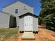 Exterior view of shed in backyard with wood deck at 1208 Olympic Dr, Mebane, NC 27302