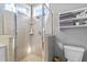 This bathroom features a glass shower with tiled walls and a shelf at 1209 Harp St, Raleigh, NC 27604