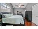 This bedroom has a ceiling fan and natural light from the window at 1209 Harp St, Raleigh, NC 27604