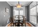 Cozy dining area featuring a modern light fixture and neutral color palette at 1209 Harp St, Raleigh, NC 27604