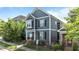 Charming two-story home with gray siding, white trim, and front yard landscaping at 1209 Harp St, Raleigh, NC 27604