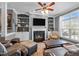 Inviting living room featuring a fireplace, custom built-ins, and a large comfortable sofa at 1209 Harp St, Raleigh, NC 27604