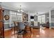 Bright living room with hardwood floors, a cozy fireplace, and built-in shelving offering ample space at 1209 Harp St, Raleigh, NC 27604
