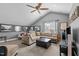 Spacious living room with vaulted ceilings, large sectional sofa and carpeted flooring at 1209 Harp St, Raleigh, NC 27604
