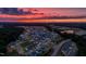 Picturesque aerial view of homes in a community at sunset, showcasing the neighborhood layout at 1218 S Franklin St, Wake Forest, NC 27587