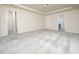Large carpeted bedroom with ensuite and walk-in closet provides plenty of space at 1218 S Franklin St, Wake Forest, NC 27587