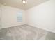 Bedroom with neutral walls, carpet, and natural light from a window creates a serene space at 1218 S Franklin St, Wake Forest, NC 27587