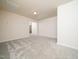 A spacious bedroom boasts neutral walls, plush carpeting, and ample natural light at 1218 S Franklin St, Wake Forest, NC 27587