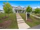 Desirable townhome showcasing a landscaped front yard, concrete steps, and a 'Home for Sale' sign at 1218 S Franklin St, Wake Forest, NC 27587