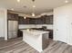 Modern kitchen with stainless steel appliances, granite countertops, and center island at 1218 S Franklin St, Wake Forest, NC 27587