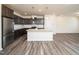 Modern kitchen with stainless steel appliances and center island, ideal for cooking and entertaining at 1218 S Franklin St, Wake Forest, NC 27587
