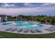 Community swimming pool with lounge chairs and a nearby pergola, perfect for relaxation at 1218 S Franklin St, Wake Forest, NC 27587