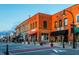 Charming street lined with brick buildings featuring awnings and storefronts in a downtown setting at 1218 S Franklin St, Wake Forest, NC 27587
