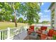 Relax on the back deck with comfortable seating and scenic views of the golf course and lake at 12527 Bellstone Ln, Raleigh, NC 27614