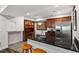 Finished basement boasts a bar area with granite counters and stainless appliances at 12527 Bellstone Ln, Raleigh, NC 27614