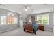 Bright bedroom features a large window and comfortable furnishings at 12527 Bellstone Ln, Raleigh, NC 27614