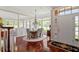 Elegant dining room with hardwood floors, chandelier, and ample natural light at 12527 Bellstone Ln, Raleigh, NC 27614