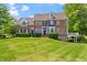 Beautiful brick home with a manicured lawn and charming front entrance at 12527 Bellstone Ln, Raleigh, NC 27614