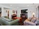 Cozy living room featuring plush seating and a fireplace at 12527 Bellstone Ln, Raleigh, NC 27614