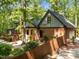 Home exterior, featuring a brick facade, mature trees, and a manicured lawn at 12537 Birchfalls Dr, Raleigh, NC 27614