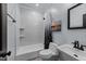 This beautifully renovated bathroom features modern tiling, and stylish fixtures and provides a relaxing atmosphere at 12537 Birchfalls Dr, Raleigh, NC 27614