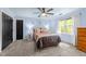 Bedroom featuring a ceiling fan, plush carpet, and lots of natural light at 12537 Birchfalls Dr, Raleigh, NC 27614