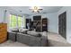 Bedroom with large window and a comfortable gray couch at 12537 Birchfalls Dr, Raleigh, NC 27614