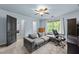 Bedroom with a large sofa and open doorway at 12537 Birchfalls Dr, Raleigh, NC 27614