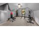 Exercise room with gym equipment and a window that provides natural light at 12537 Birchfalls Dr, Raleigh, NC 27614