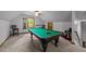 Spacious game room with pool table, perfect for entertainment at 12537 Birchfalls Dr, Raleigh, NC 27614