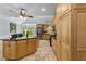 Spacious eat-in kitchen features a center island, stainless appliances, stone floors, and custom cabinets at 12537 Birchfalls Dr, Raleigh, NC 27614