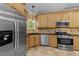 This kitchen features stainless steel appliances, granite countertops, and custom cabinets at 12537 Birchfalls Dr, Raleigh, NC 27614