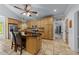 Large kitchen featuring an island with granite countertops, light wood cabinets and tile floors at 12537 Birchfalls Dr, Raleigh, NC 27614