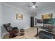 Home office with a ceiling fan, modern desk, and ergonomic chair at 12537 Birchfalls Dr, Raleigh, NC 27614
