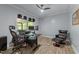 Home office featuring an ergonomic chair, ceiling fan, and screened-in porch views at 12537 Birchfalls Dr, Raleigh, NC 27614